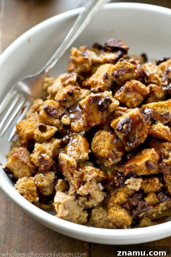 Warm Mocha Bread Pudding with Caramel Rum Drizzle 4 A close-up of a fork scooping into the soft, moist interior of the coffee bread pudding, showcasing its rich texture.