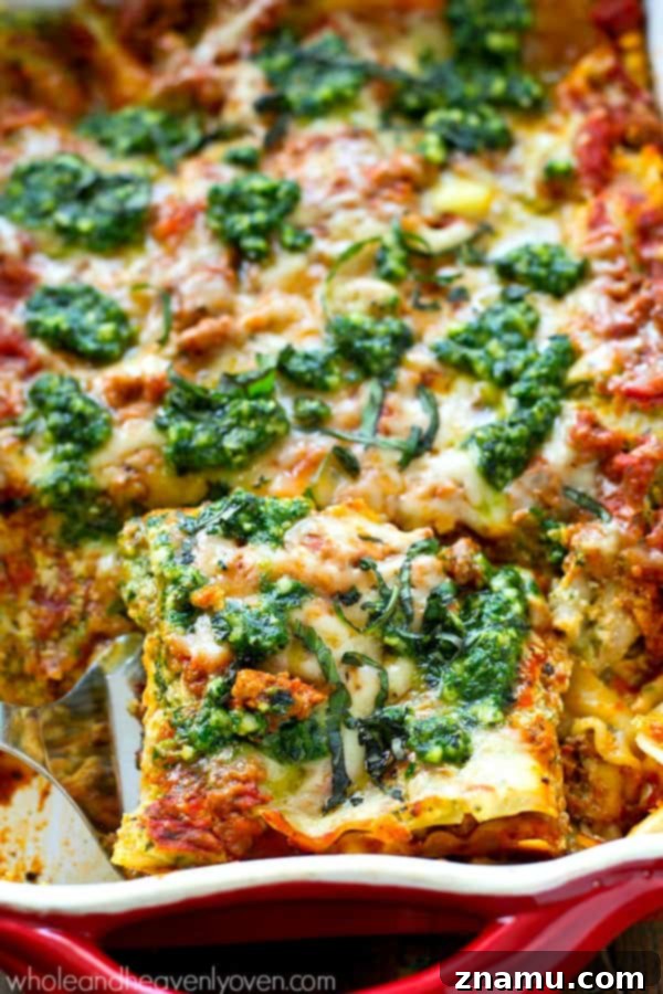 Rich and savory Three-Cheese Pesto Turkey Lasagna, layered with creamy cheese and flavorful pesto