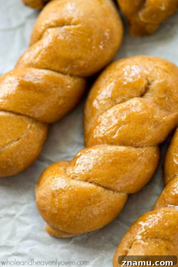 Mock Sourdough Bread Twists No Starter 6 Several golden-brown sourdough bread twists cooling on a wire rack, ready for a generous brushing of melted butter.