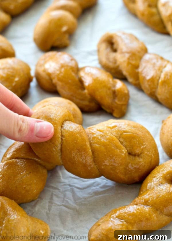 Mock Sourdough Bread Twists No Starter 7 A basket overflowing with freshly baked, mock sourdough bread twists, showcasing their rustic charm and golden-brown crust.