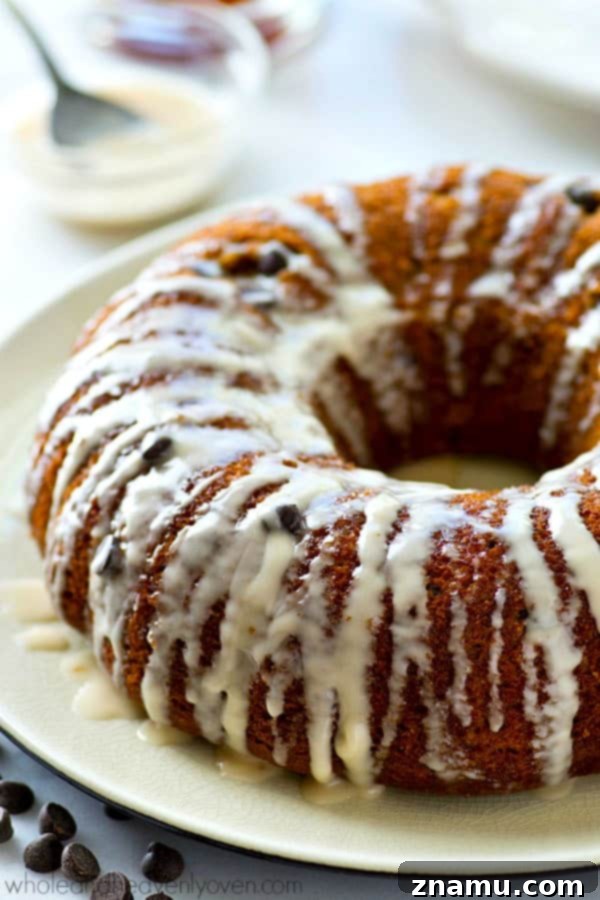 The absolute BEST classic sour cream coffee cake you'll ever have! Studded with gooey chocolate inside and covered with plenty of glaze.
