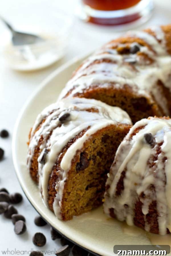 The absolute BEST classic sour cream coffee cake you'll ever have! Studded with gooey chocolate inside and covered with plenty of glaze.