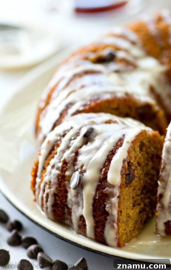 The absolute BEST classic sour cream coffee cake you'll ever have! Studded with gooey chocolate inside and covered with plenty of glaze.