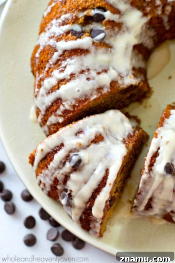 The absolute BEST classic sour cream coffee cake you'll ever have! Studded with gooey chocolate inside and covered with plenty of glaze.