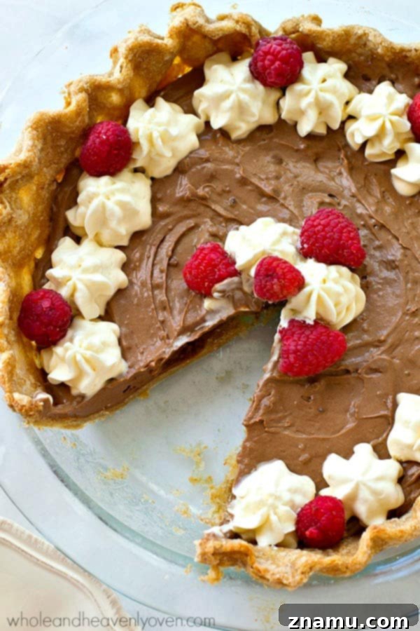 Light French Silk Chocolate Pie 6 A slice of Lighter French Silk Chocolate Pie with fresh raspberries.