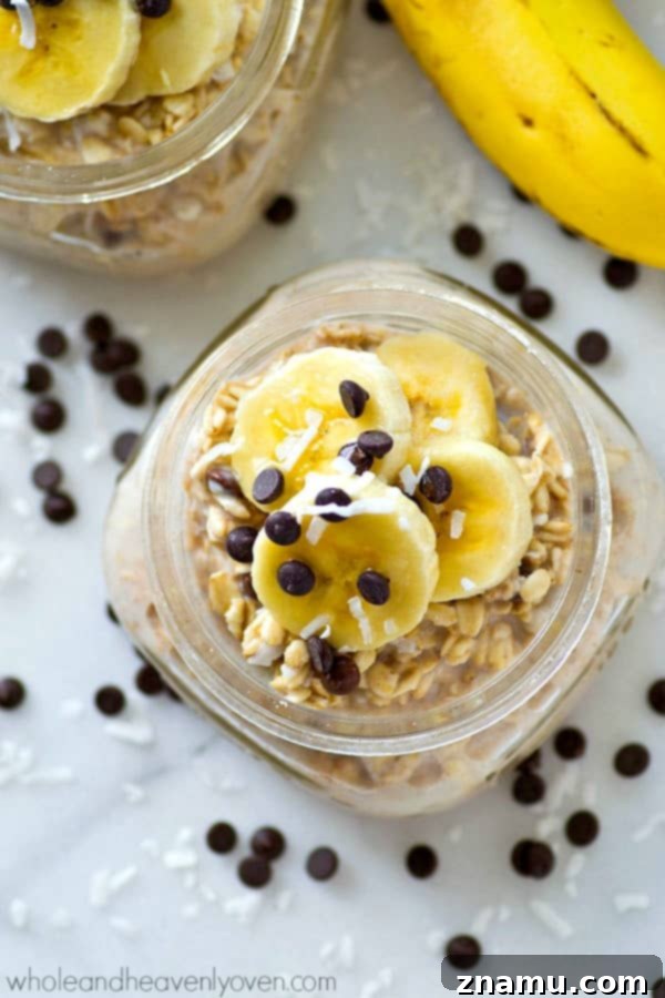 Chai Spiced Banana Overnight Oats 2 Close-up of a jar of Banana Chai Spice Overnight Oats, garnished with banana slices and a sprinkle of chai spice.