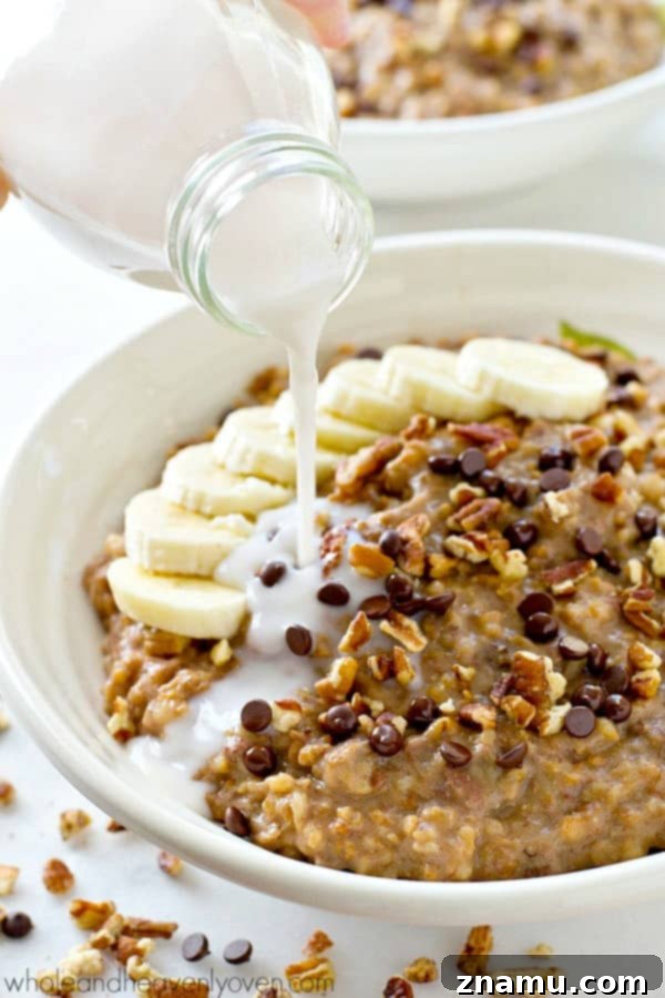 Chai Spiced Banana Overnight Oats 10 Crockpot Banana Bread Steel-Cut Oatmeal slow-cooked for hours, infused with banana bread flavors, served in a bowl.