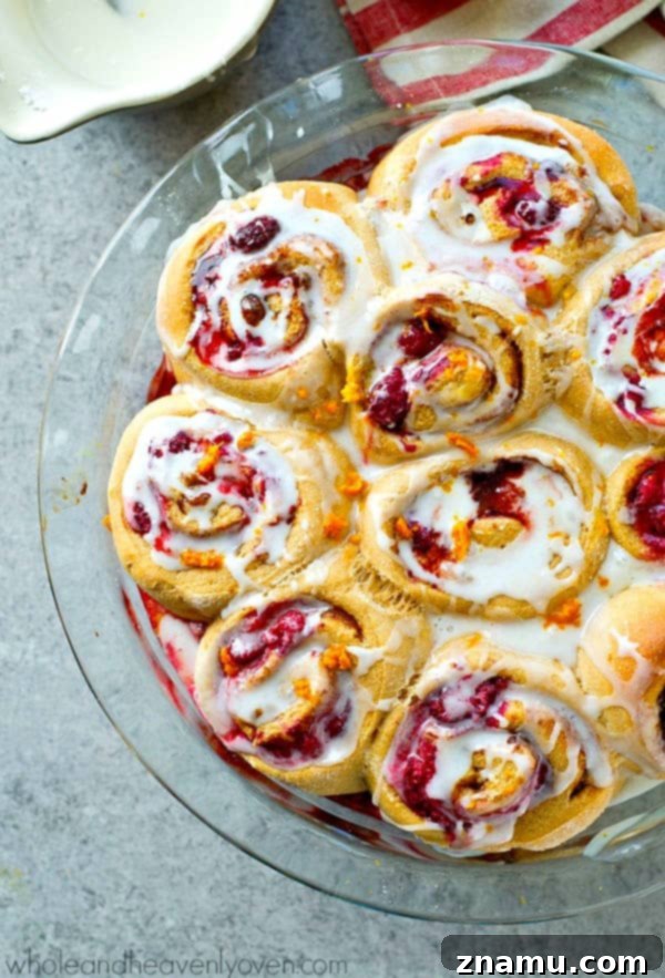 Zesty Orange Raspberry Swirl Buns 2 Luscious Orange Raspberry Swirl Cinnamon Rolls, soft as clouds and perfect for spring brunch.