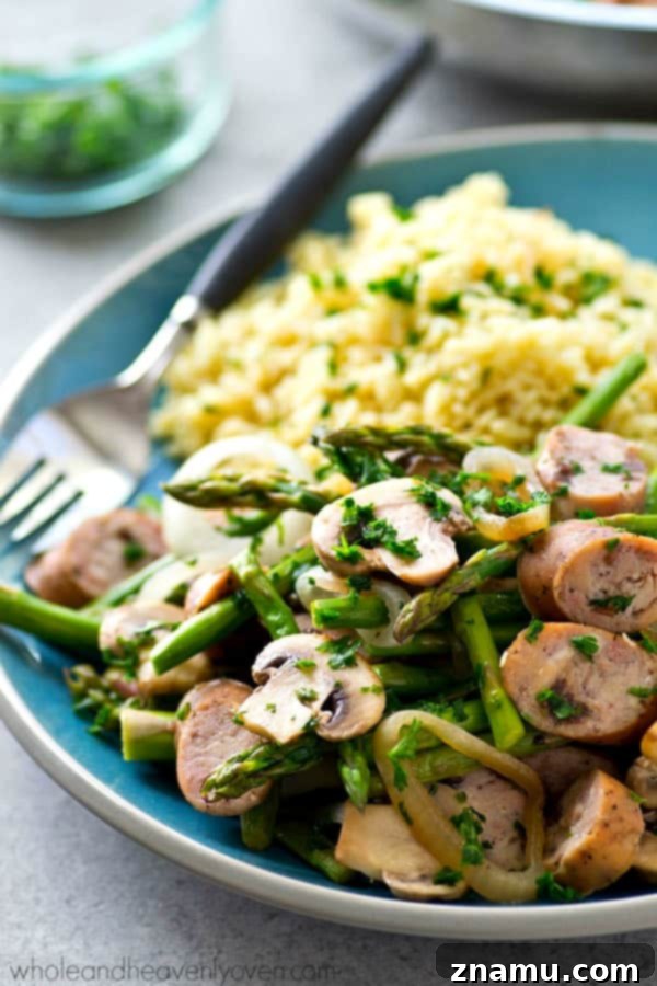 Balsamic Sausage, Asparagus and Mushroom Skillet 5 Adding sliced chicken sausage to the skillet with cooked vegetables.