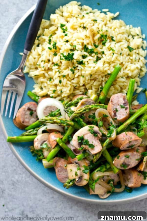 Balsamic Sausage, Asparagus and Mushroom Skillet 7 A serving of balsamic sausage, asparagus, and mushroom skillet with hot rice.
