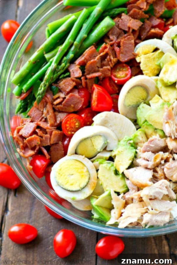 Bright Asparagus Cobb Salad with a Tangy Red Wine Vinaigrette 2 A vibrant Springtime Asparagus Cobb Salad with colorful ingredients and a rich red wine vinaigrette