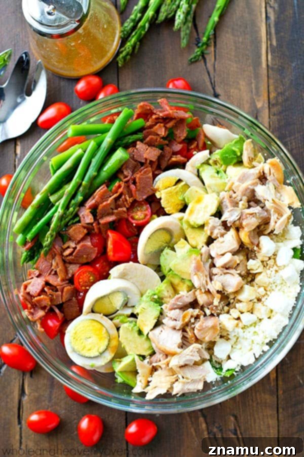 Bright Asparagus Cobb Salad with a Tangy Red Wine Vinaigrette 6 Close-up of the Springtime Asparagus Cobb Salad, highlighting the crisp romaine and vibrant, fresh toppings