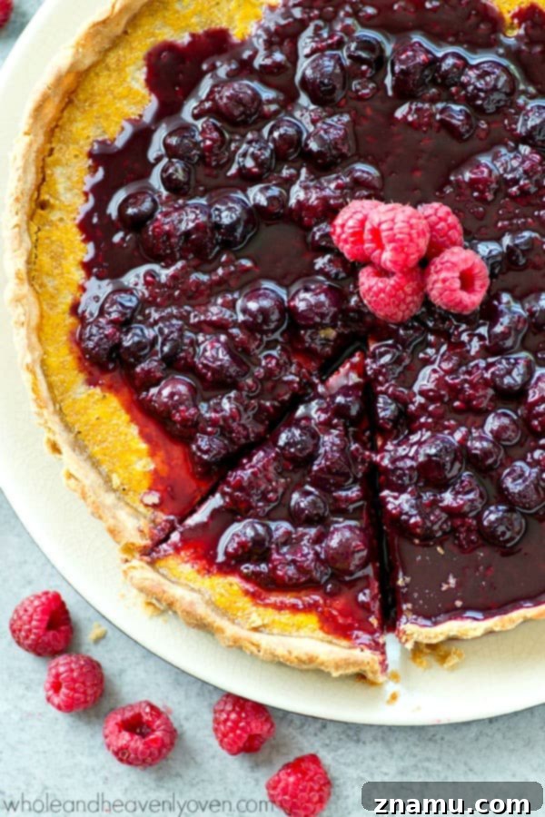 Another perspective of the lemon tart, emphasizing its smooth texture.