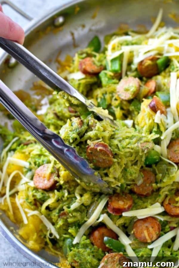 One-Pan Pesto Sausage Spaghetti Squash 6 Spaghetti squash loaded with flavorful pesto and lots of sliced sausage! An easy and healthy skillet dinner with only 7 ingredients!