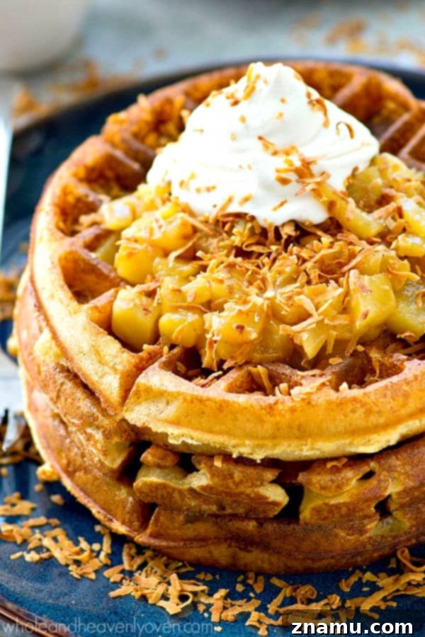 Tropical Overnight Waffle Bliss 2 Light and unbelievably crispy yeast waffles with golden edges, served with warm pineapple pina colada topping and whipped cream.