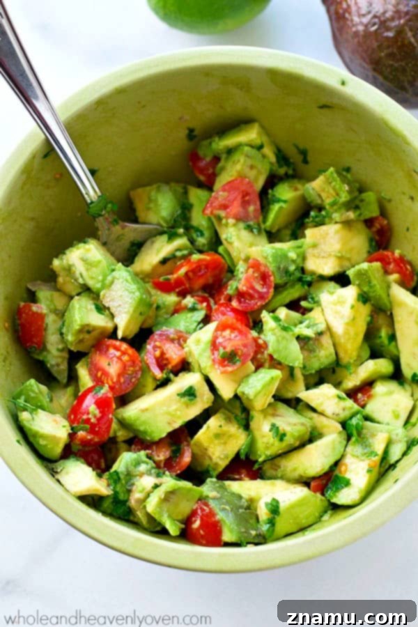 Gourmet Savory Crepes: Scrambled Eggs & Zesty Avocado Pico 5 A close-up of the fresh, vibrant avocado pico de gallo with diced tomatoes, onions, cilantro, and creamy avocado pieces.