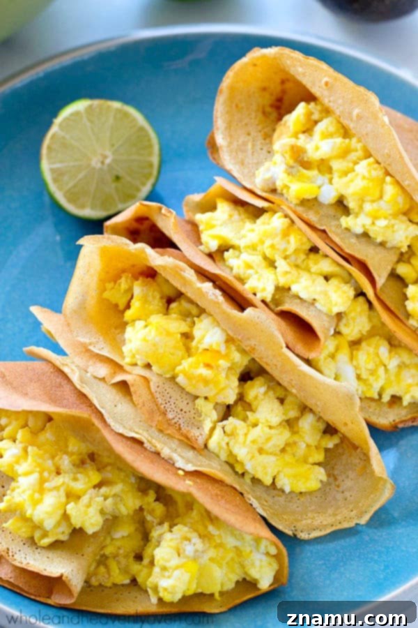 Gourmet Savory Crepes: Scrambled Eggs & Zesty Avocado Pico 6 Several savory crepes, folded and arranged on a plate, garnished with avocado pico de gallo and fresh cilantro.