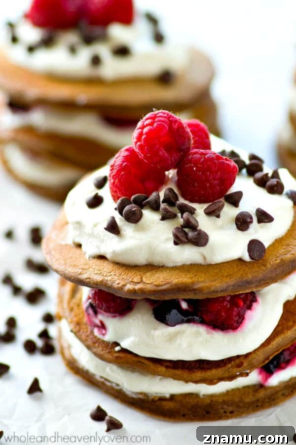 Decadent Mini Chocolate Raspberry Pancake Stacks 5 Fresh raspberries, whipped cream, and mini chocolate chips stuffed between 3 layers of ultra-fluffy mini chocolate pancakes! These pancake stacks are a brunch must-have.