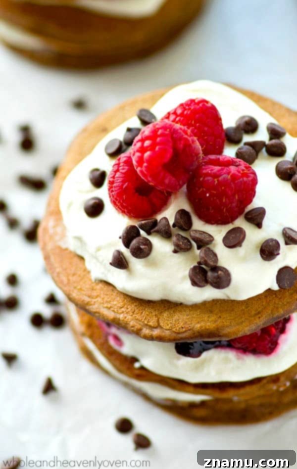 Decadent Mini Chocolate Raspberry Pancake Stacks 6 Fresh raspberries, whipped cream, and mini chocolate chips stuffed between 3 layers of ultra-fluffy mini chocolate pancakes! These pancake stacks are a brunch must-have.