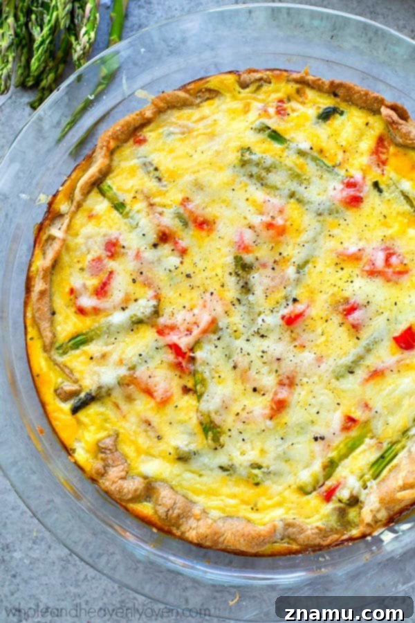 Perfect for a fancy brunch or just a lazy weekend breakfast, this spring veggie-loaded cheese quiche is the ONLY way you're going to want to eat your eggs!