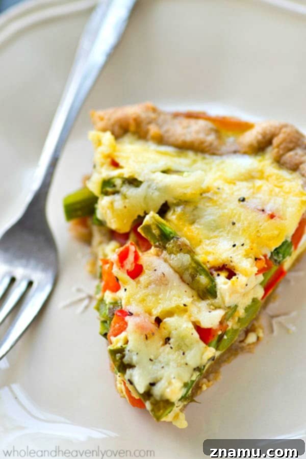 Perfect for a fancy brunch or just a lazy weekend breakfast, this spring veggie-loaded cheese quiche is the ONLY way you're going to want to eat your eggs!