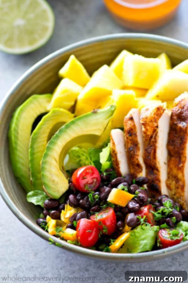 Vibrant Tropical Grilled Chicken Mexican Salad Bowls 5 Close-up of perfectly cooked Cajun-spiced grilled chicken breasts, golden brown and juicy, ready to be sliced for the Tropical Mexican Salad.