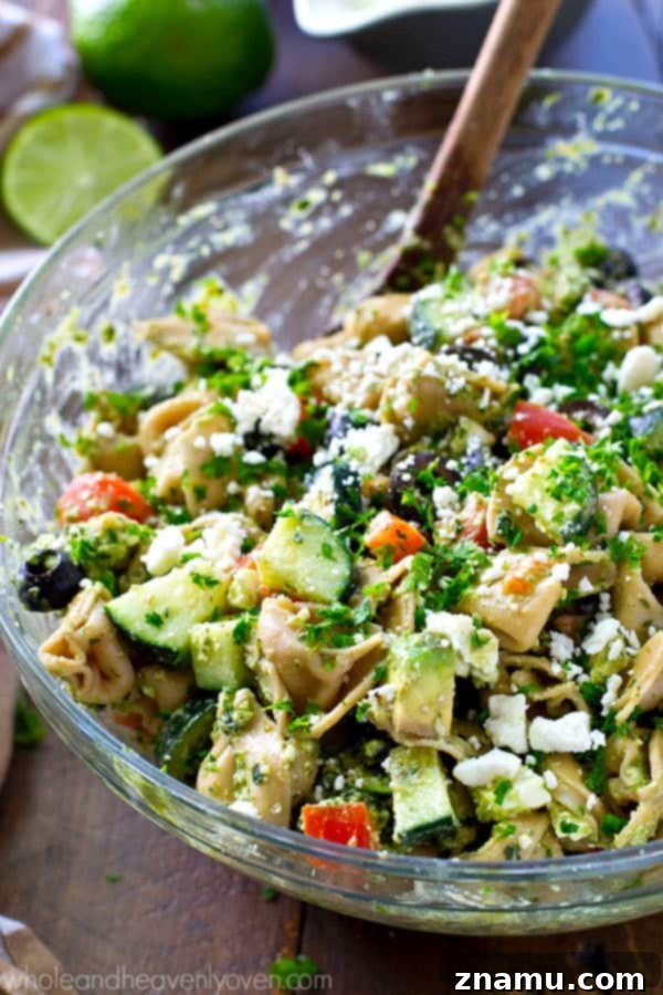 Zesty Greek Pesto Tortellini Salad 2 Your new favorite summer salad! This easy tortellini pasta salad is piled high with Greek-style goodness and tossed in an amazing pesto dressing.