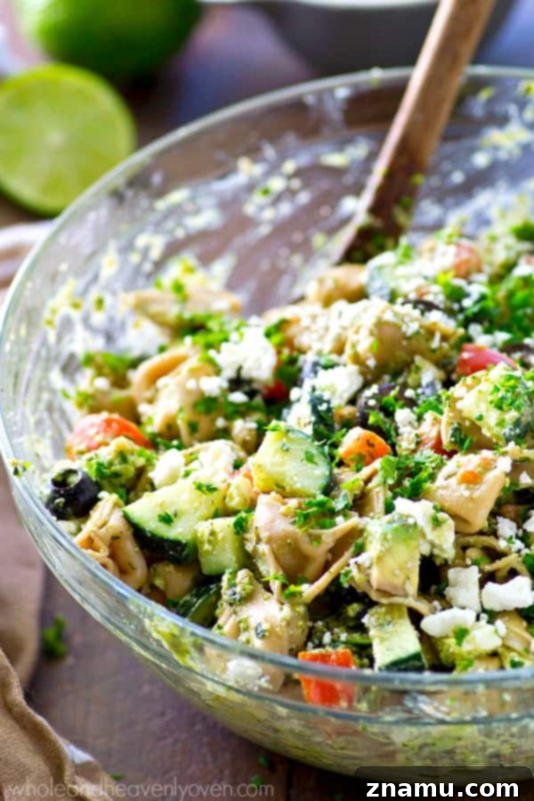 Zesty Greek Pesto Tortellini Salad 3 Your new favorite summer salad! This easy tortellini pasta salad is piled high with Greek-style goodness and tossed in an amazing pesto dressing.