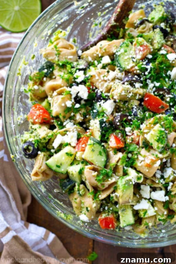 Zesty Greek Pesto Tortellini Salad 4 Your new favorite summer salad! This easy tortellini pasta salad is piled high with Greek-style goodness and tossed in an amazing pesto dressing.