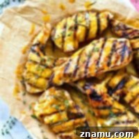 Marinated for hours in a sweet 'n' tangy homemade honey mustard and then grilled to smoky perfection, these honey mustard chicken cutlets will quickly become a summer grilling favorite!