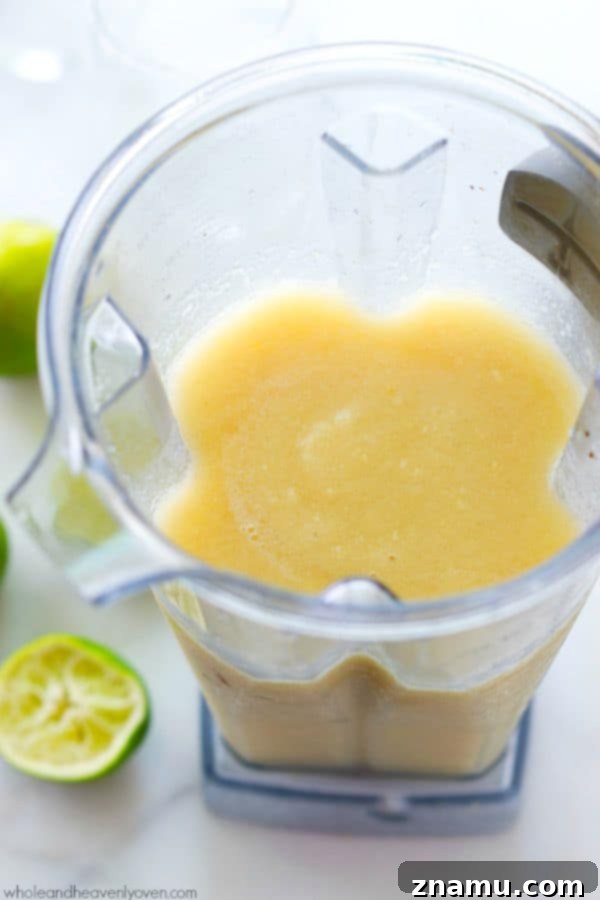 Icy-cold tropical pineapple margarita slushies, a refreshing summer drink.