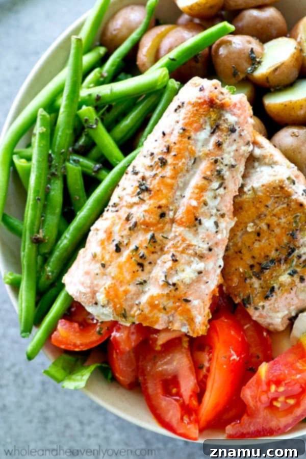 Plated Seared Salmon Nicoise Salad, showing its exquisite presentation