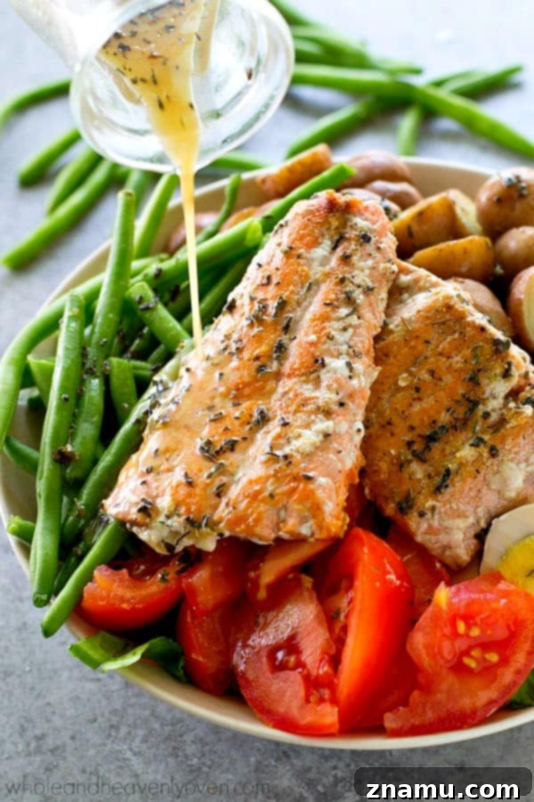 Detailed shot of the Seared Salmon Nicoise Salad, highlighting the salmon's texture