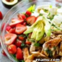Juicy balsamic-grilled chicken and lots of fresh strawberries and creamy mozzarella cheese make for the ULTIMATE twist on caprese salad!