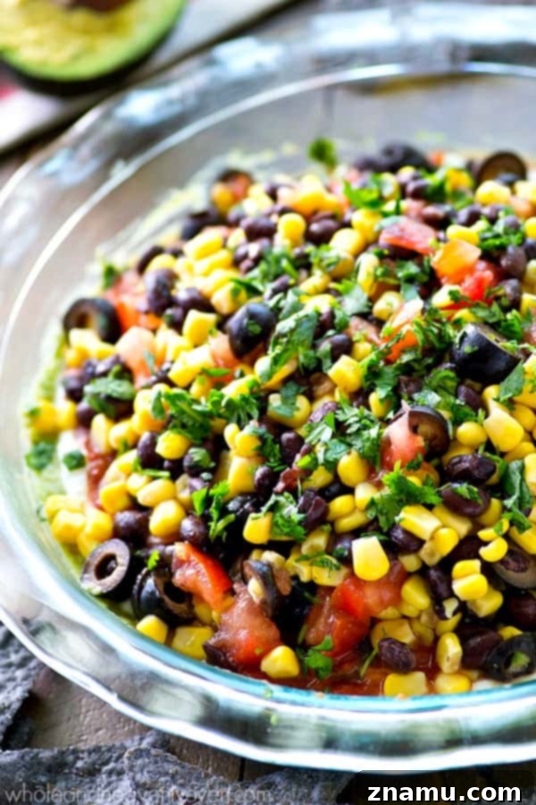 Southwest Guac Fiesta 5 This colorful Southwestern-style taco dip will be the biggest hit of your party.---So many layers of homemade guacamole and all your favorite taco toppings!