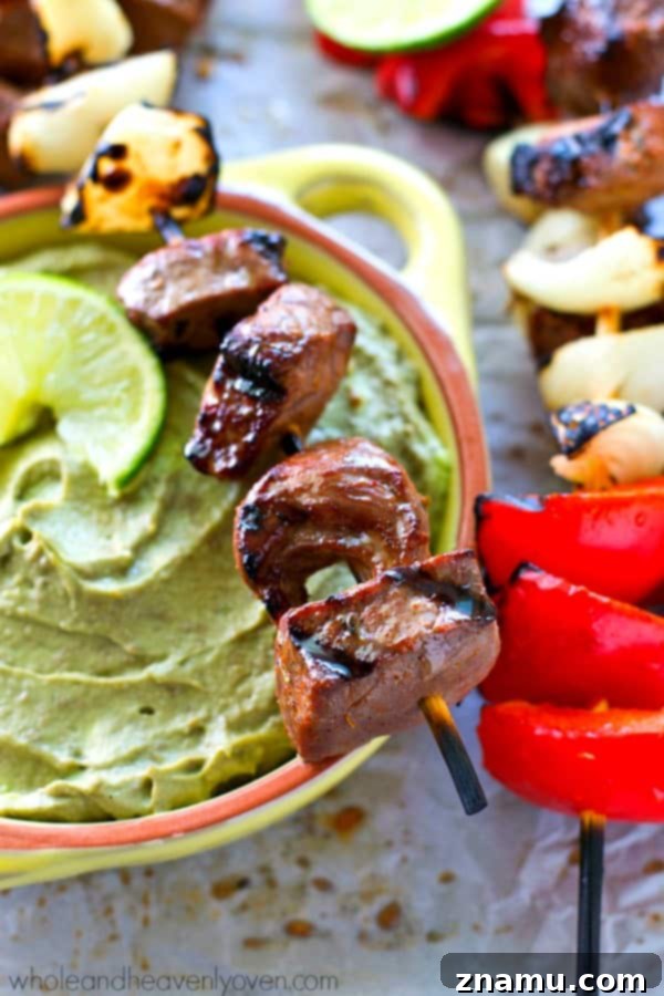 Platter of grilled steak and pepper kebabs, beautifully charred and ready to serve.