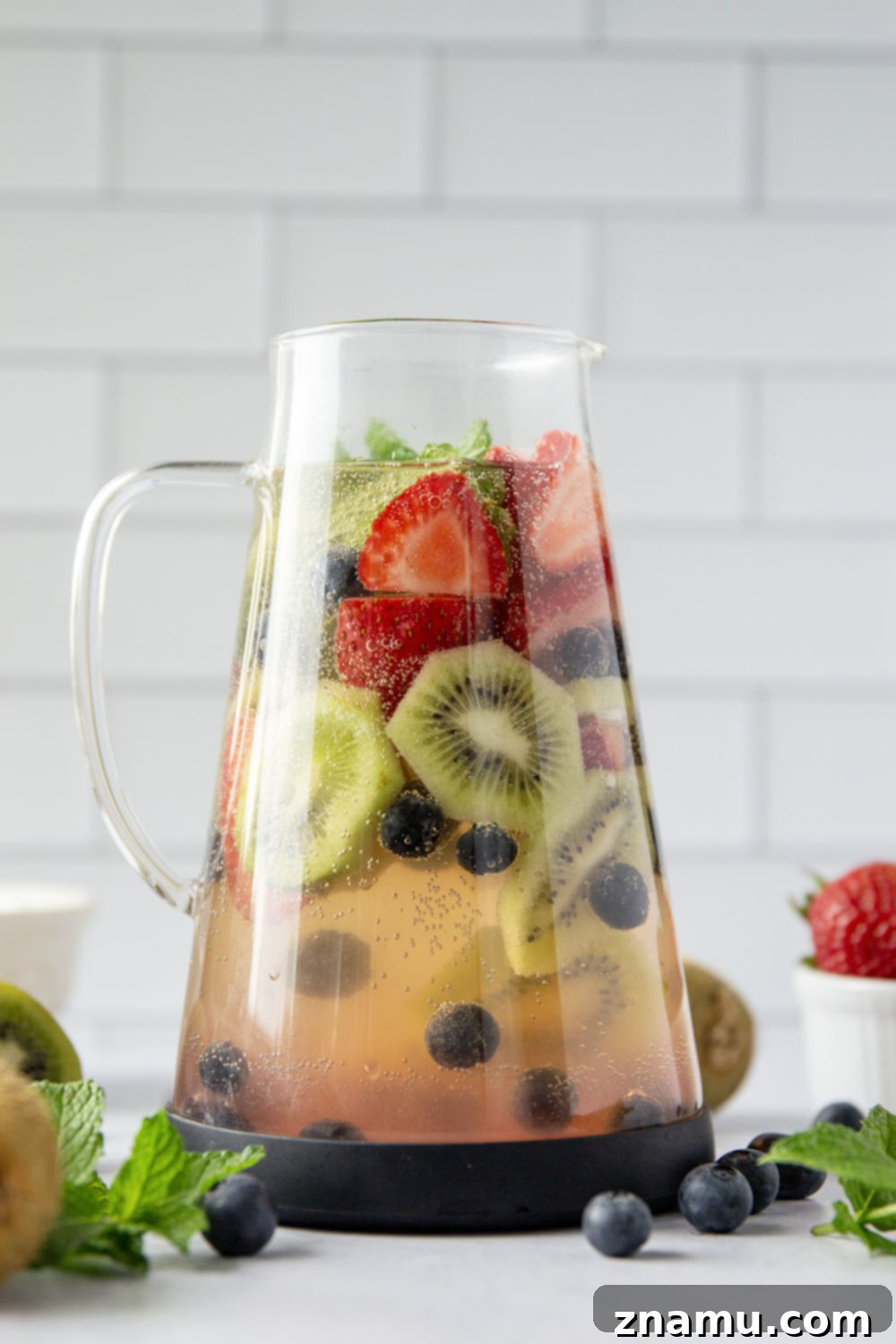 Berry Kiwi Bliss Sangria 2 This bubbly mixed berry kiwi sangria is so easy to make you'll find yourself making it all summer long! Perfect for entertaining or for just a casual weekend sipper.