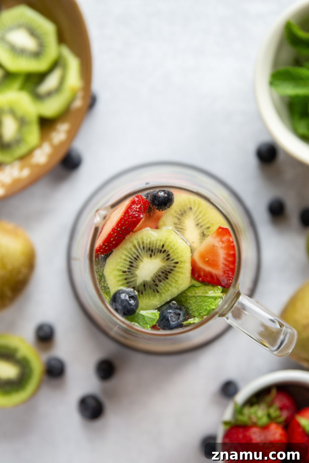Berry Kiwi Bliss Sangria 3 This bubbly mixed berry kiwi sangria is so easy to make you'll find yourself making it all summer long! Perfect for entertaining or for just a casual weekend sipper.