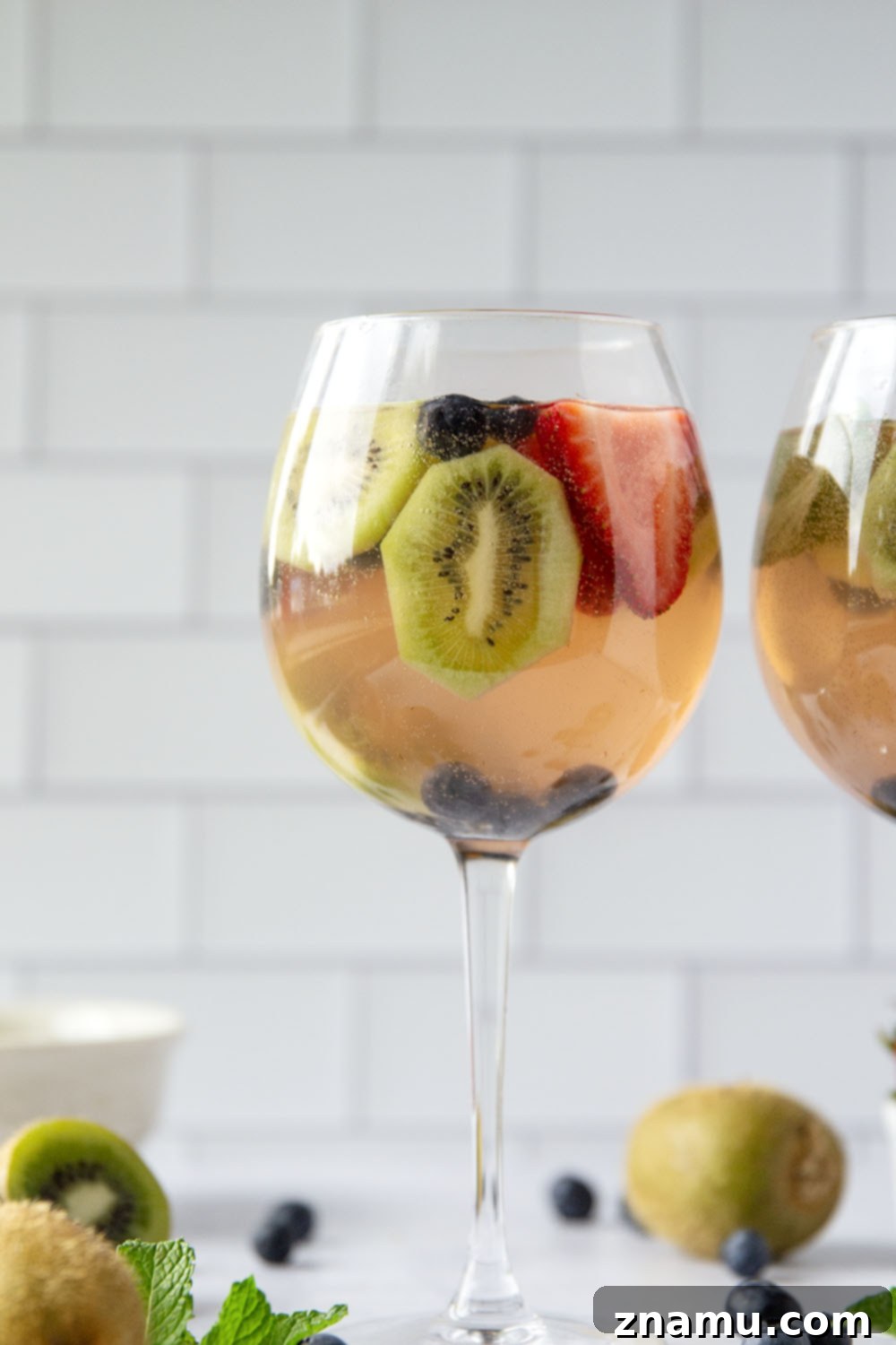 Berry Kiwi Bliss Sangria 4 This bubbly mixed berry kiwi sangria is so easy to make you'll find yourself making it all summer long! Perfect for entertaining or for just a casual weekend sipper.