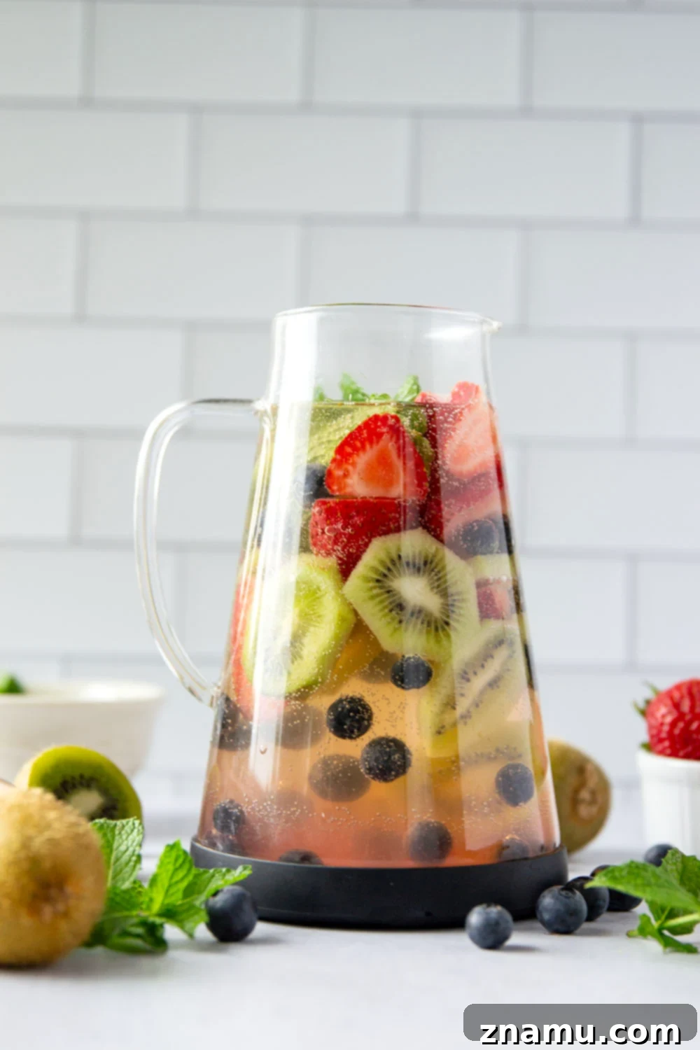 Berry Kiwi Bliss Sangria 5 This bubbly mixed berry kiwi sangria is so easy to make you'll find yourself making it all summer long! Perfect for entertaining or for just a casual weekend sipper.