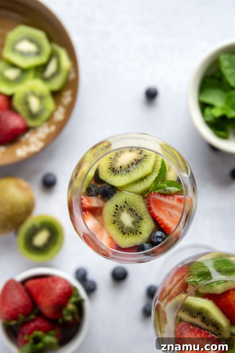 Berry Kiwi Bliss Sangria 6 This bubbly mixed berry kiwi sangria is so easy to make you'll find yourself making it all summer long! Perfect for entertaining or for just a casual weekend sipper.