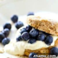 Tender and buttery oat-packed biscuits are filled with tons of zingy lemon whipped cream and piled high with beautiful fresh blueberries for a simple, yet stunning summer dessert.