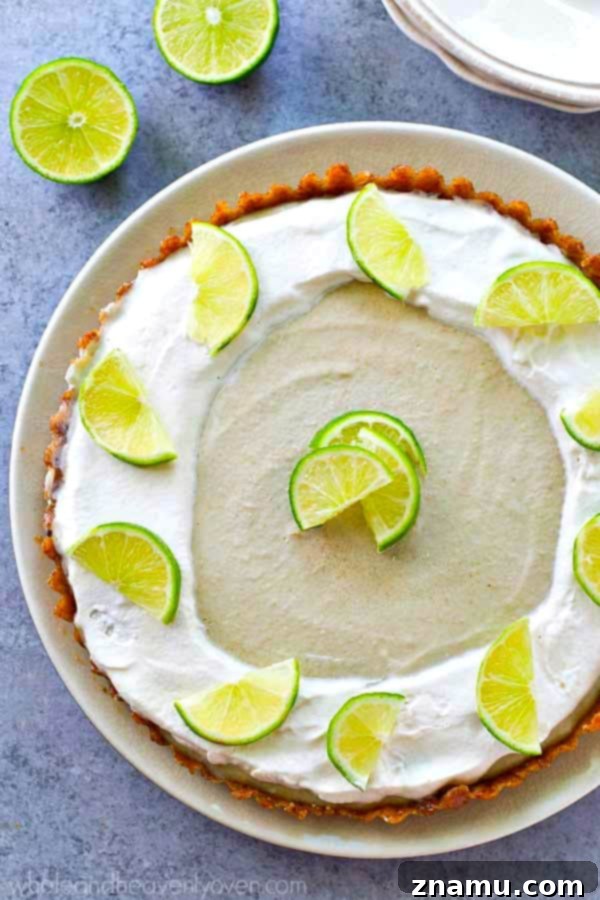 Effortless Key Lime Cheesecake Tart 3 Close-up of a slice of no-bake key lime cheesecake tart, showing its creamy texture