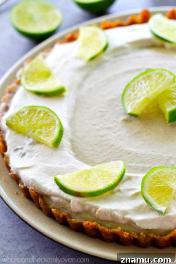 Effortless Key Lime Cheesecake Tart 5 Side view of the no-bake key lime cheesecake tart, showing the distinct layers