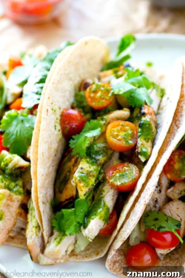 Chargrilled Greek Chicken Tacos with Fresh Herb Chimichurri 5 Close-up of the vibrant green chimichurri sauce, highlighting its fresh, herbaceous qualities.