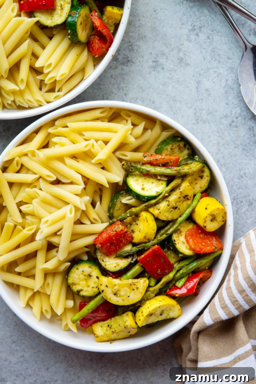Smoky Veggie Pesto Penne 2 Tossed in flavorful pesto and grilled to smoky perfection, these pesto grilled vegetables are incredible piled over penne pasta and a great way to use up summer produce!