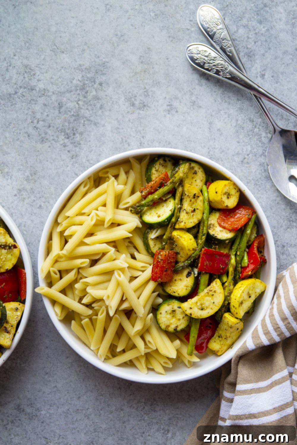 Smoky Veggie Pesto Penne 4 Tossed in flavorful pesto and grilled to smoky perfection, these pesto grilled vegetables are incredible piled over penne pasta and a great way to use up summer produce!