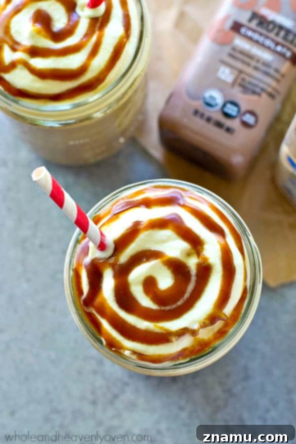 Lighter Salted Caramel Mocha Frappuccino Plus Giveaway 4 Lighter Salted Caramel Mocha Frappuccino served in a tall glass, garnished with whipped cream and caramel