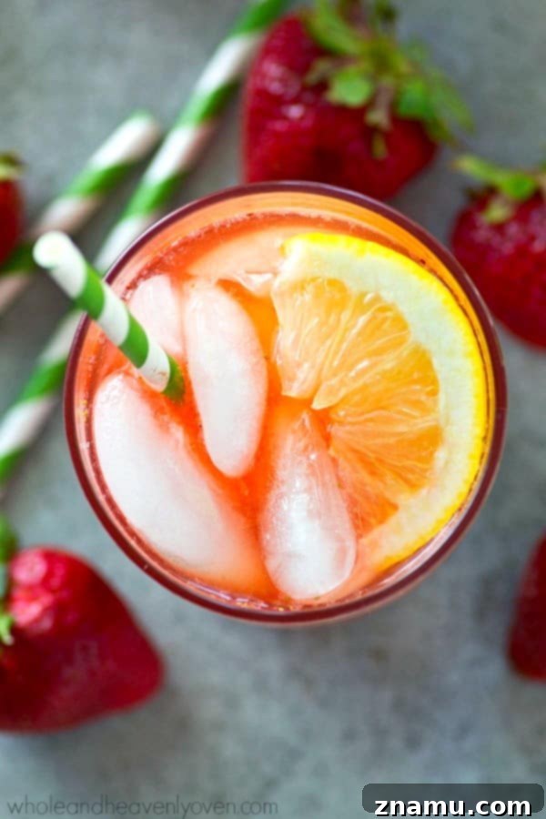 Strawberry Sunset Lemonade Cocktail 4 A pitcher of freshly made Pink Strawberry Lemonade Cocktail, ready to be served