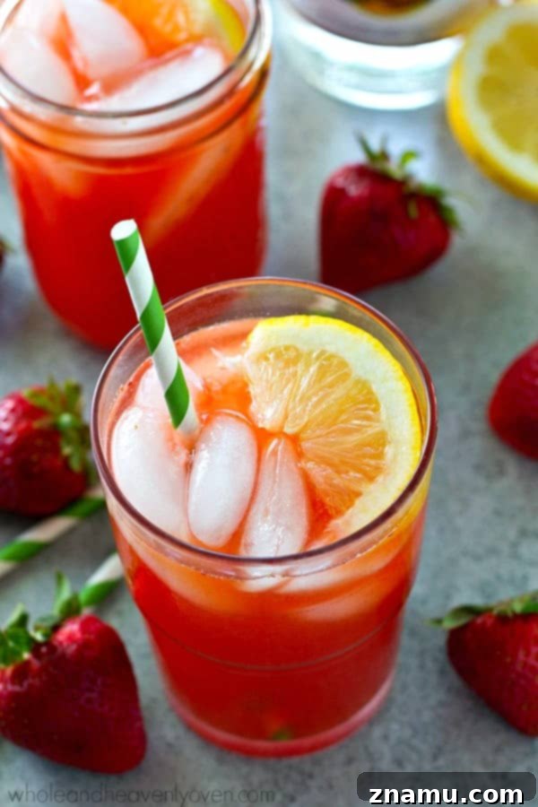 Strawberry Sunset Lemonade Cocktail 6 Ingredients for the Boozy Strawberry Lemonade Cocktail laid out on a table
